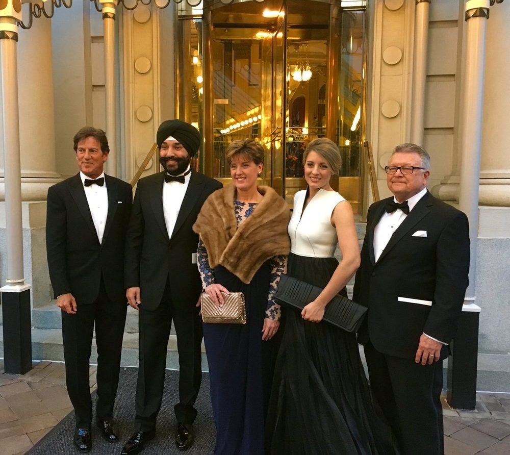 Five people in black tie outside a hotel entrance in Washington, left to right: Stephen Bronfman, Navdeep Bains, Marie-Claude Bibeau, Mélanie Joly and Ralph Goodale.